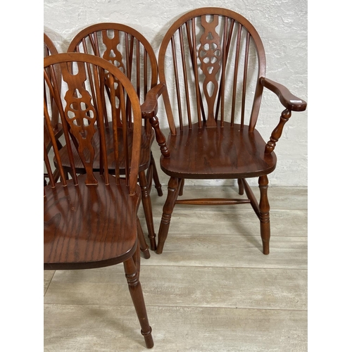 245 - Six elm and beech wheelback dining chairs