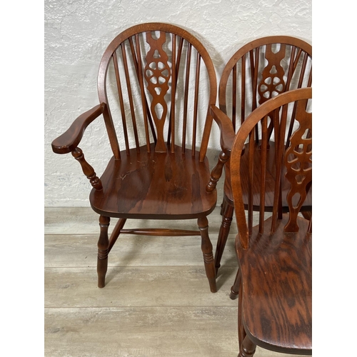 245 - Six elm and beech wheelback dining chairs