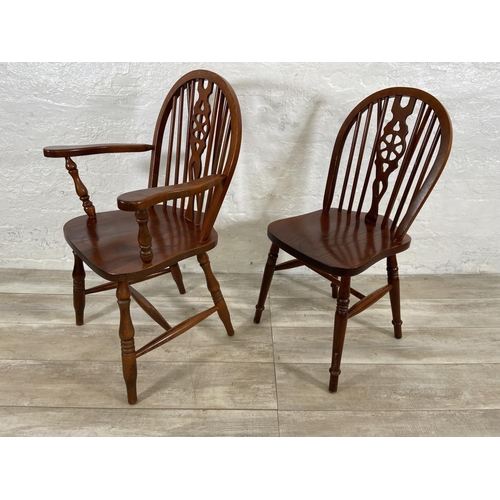 245 - Six elm and beech wheelback dining chairs