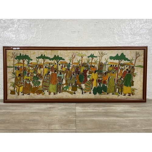 292 - A 20th century framed Batik signed lower right - approx. 78cm high x 197cm wide