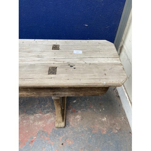 125 - A mid 20th century wooden bench - approx. 44cm high x 245cm wide x 28cm deep