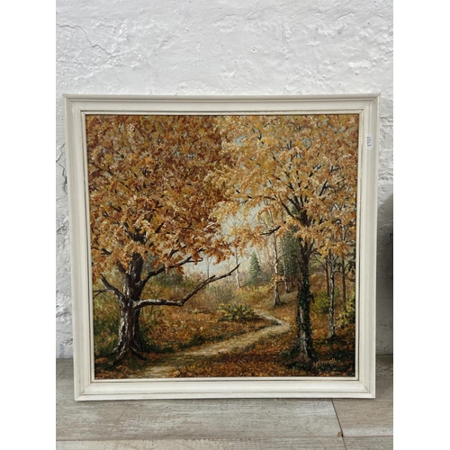 256 - Three framed items, one M. Newell oil on board of a woodland scene, one early 20th century oak frame... 