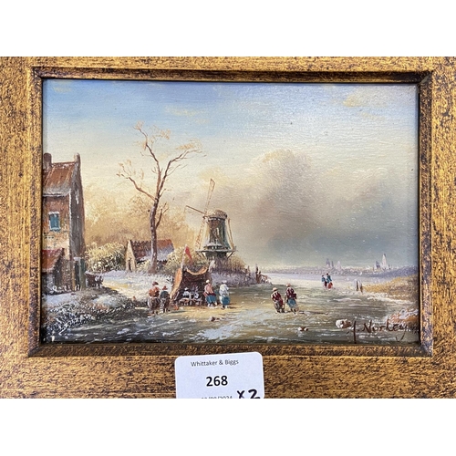 268 - Two gilt framed Adrian Norley oil paintings on board of Dutch frozen river scenes - approx. 41cm hig... 