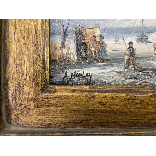 268 - Two gilt framed Adrian Norley oil paintings on board of Dutch frozen river scenes - approx. 41cm hig... 