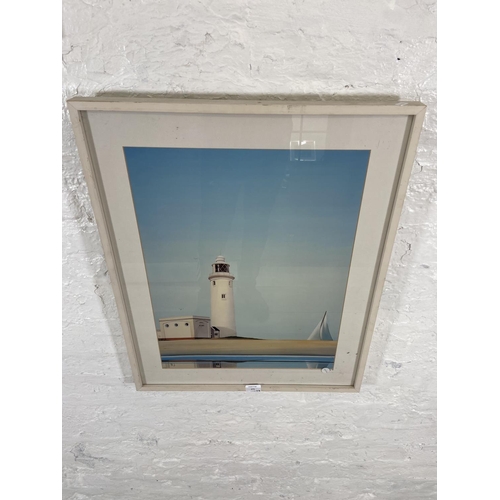 271 - Two framed B. J. lighthouse scene prints, one titled 'One Of These Mornings' and one titled 'Calm Da... 