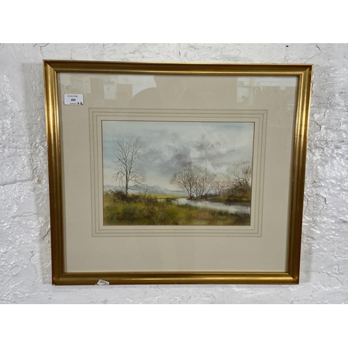 284 - Two gilt framed Ken J. Messer (1931-2018) watercolours of landscapes - largest approx. 58cm high x 6... 