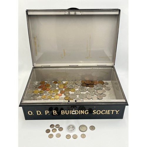 2214 - A vintage metal deed box marked O.D.P.B. Building Society containing coins to include encapsulated 2... 