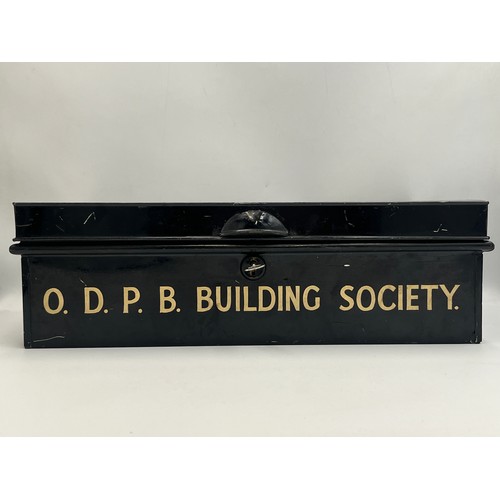 2214 - A vintage metal deed box marked O.D.P.B. Building Society containing coins to include encapsulated 2... 