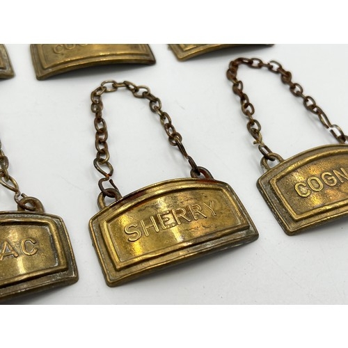 2213 - Six vintage brass decanter labels