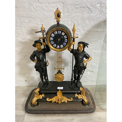 183 - A French Japy Freres gilded spelter figural two train clock with glass dome, pendulum and key on ebo... 