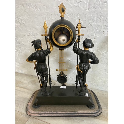 183 - A French Japy Freres gilded spelter figural two train clock with glass dome, pendulum and key on ebo... 