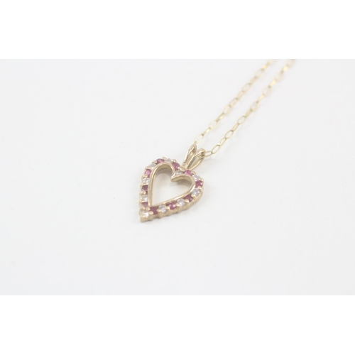 2049 - A 9ct gold ruby and cubic zirconia heart shaped pendant necklace - approx. gross weight 2g