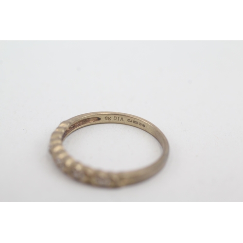 2052 - A 9ct gold diamond half eternity ring - approx. gross weight 1.6g