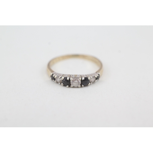 2054 - A 9ct gold sapphire and cubic zirconia half eternity ring - approx. gross weight 1.4g