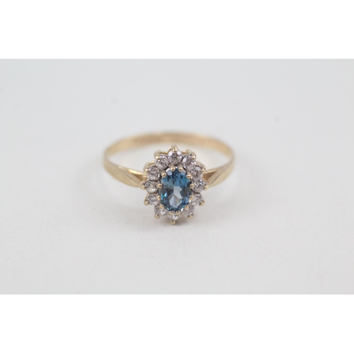 2070 - A 9ct gold blue topaz and cubic zirconia halo ring - approx. gross weight 1.7g