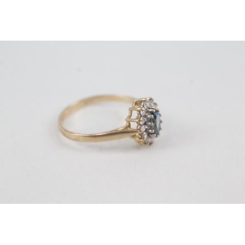 2070 - A 9ct gold blue topaz and cubic zirconia halo ring - approx. gross weight 1.7g