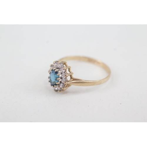 2070 - A 9ct gold blue topaz and cubic zirconia halo ring - approx. gross weight 1.7g