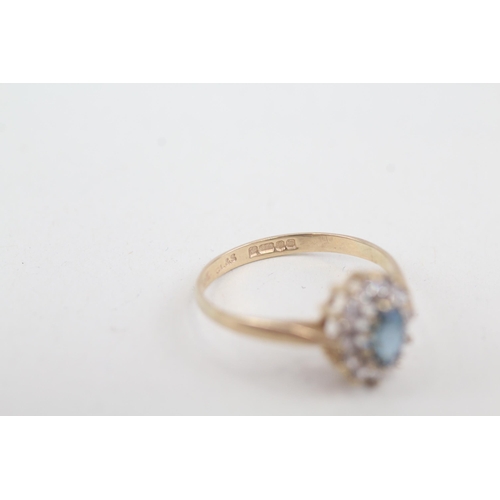 2070 - A 9ct gold blue topaz and cubic zirconia halo ring - approx. gross weight 1.7g