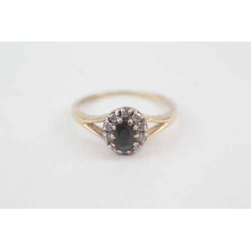 2071 - A 9ct gold oval cut sapphire and diamond halo ring - approx. gross weight 2.2g