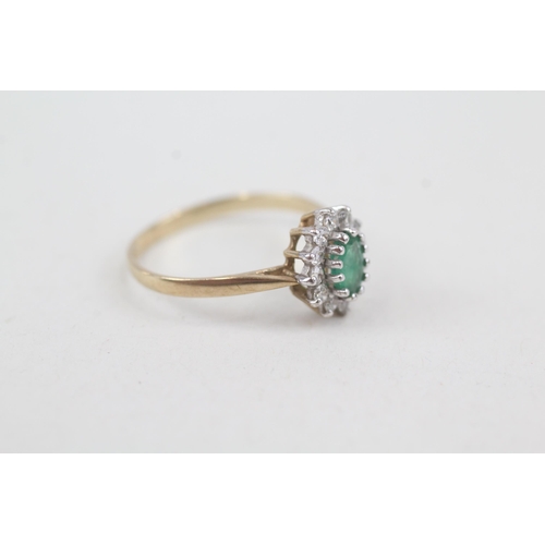 2072 - A 9ct gold emerald and cubic zirconia halo ring - approx. gross weight 1.4g