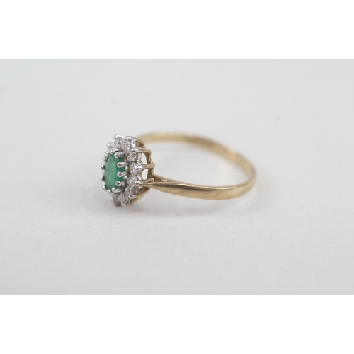 2072 - A 9ct gold emerald and cubic zirconia halo ring - approx. gross weight 1.4g