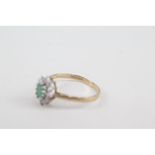 2072 - A 9ct gold emerald and cubic zirconia halo ring - approx. gross weight 1.4g