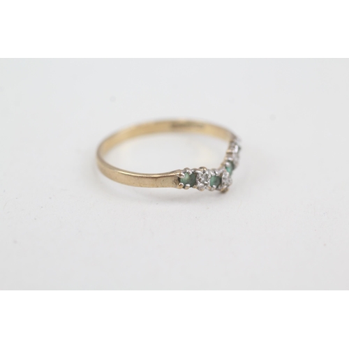 2073 - A 9ct gold emerald and diamond wishbone ring - approx. gross weight 1.1g