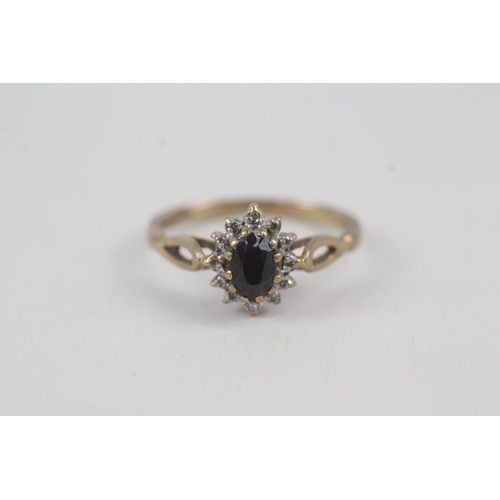 2075 - A 9ct gold sapphire and diamond halo ring - approx. gross weight 2.2g