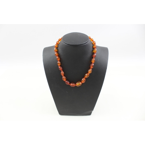 2085 - An antique amber beaded necklace with .925 silver clasp - approx. gross weight 14g