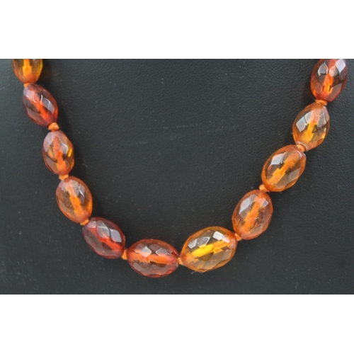 2085 - An antique amber beaded necklace with .925 silver clasp - approx. gross weight 14g