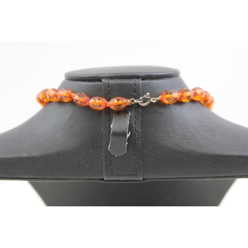 2085 - An antique amber beaded necklace with .925 silver clasp - approx. gross weight 14g