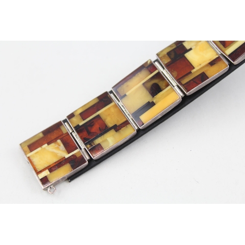 2092 - A sterling silver butterscotch amber set panel bracelet - approx. gross weight 30g