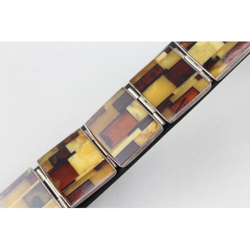 2092 - A sterling silver butterscotch amber set panel bracelet - approx. gross weight 30g