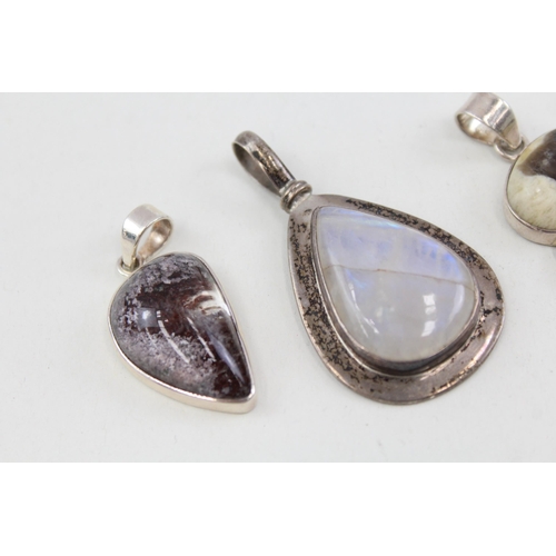 2094 - Six .925 silver gemstone set pendants to include moonstone, tiger's eye etc. - approx. gross weight ... 