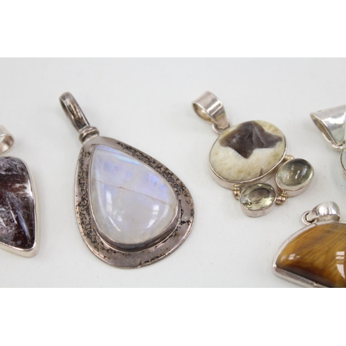 2094 - Six .925 silver gemstone set pendants to include moonstone, tiger's eye etc. - approx. gross weight ... 