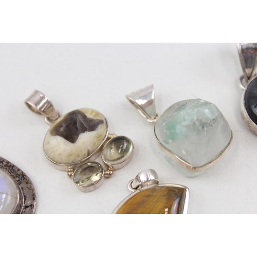 2094 - Six .925 silver gemstone set pendants to include moonstone, tiger's eye etc. - approx. gross weight ... 