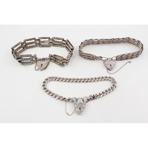 2104 - Three .925 sterling silver gate bracelets with heart shaped clasps - approx. gross weight 57g