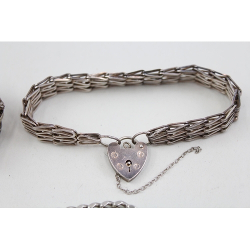 2104 - Three .925 sterling silver gate bracelets with heart shaped clasps - approx. gross weight 57g