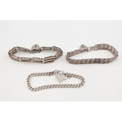 2104 - Three .925 sterling silver gate bracelets with heart shaped clasps - approx. gross weight 57g