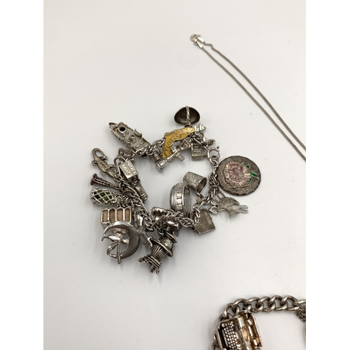 2123 - Three pieces of hallmarked .925 silver jewellery, two charm bracelets with assorted charms and one S... 