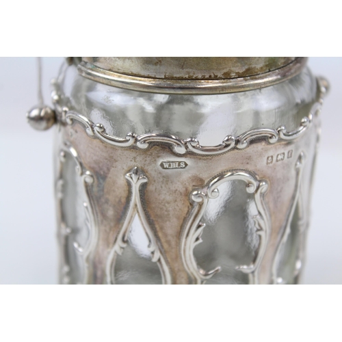 2189 - A .925 sterling silver and glass jar and cover