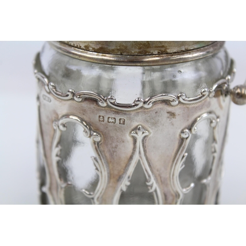 2189 - A .925 sterling silver and glass jar and cover