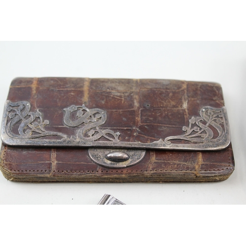 2192 - Four hallmarked sterling silver detailed items, two coin purses and two notebooks