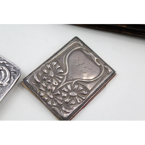 2192 - Four hallmarked sterling silver detailed items, two coin purses and two notebooks