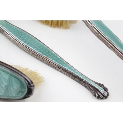 2202 - An Art Deco hallmarked Birmingham silver and guilloche enamel three piece dressing table set, dated ... 