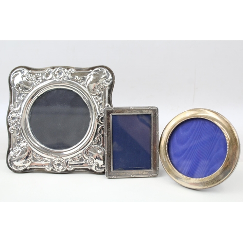 2203 - Three hallmarked sterling silver photo frames - largest approx. 17cm x 17cm