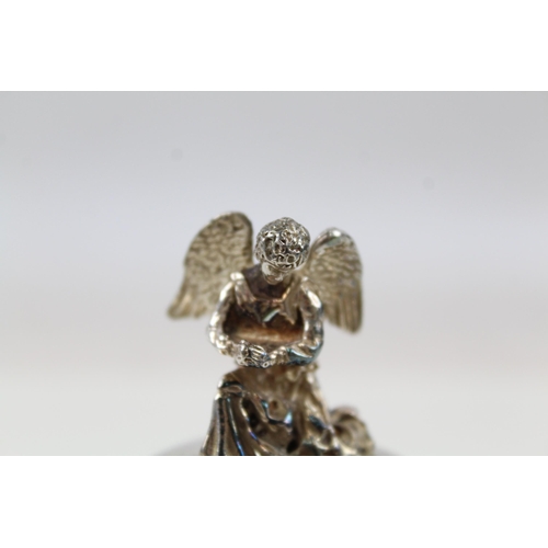 2204 - A hallmarked sterling silver angel topped bottle stopper