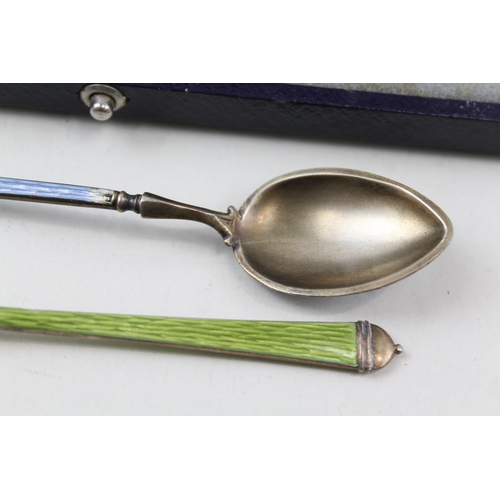 2213 - Three hallmarked sterling silver and guilloche enamel items, two teaspoons and one cased knife