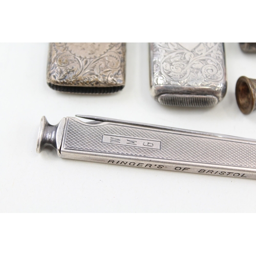 2215 - Five pieces of hallmarked sterling silver tobacciana, two vesta cases, one cigar cutter/knife and tw... 