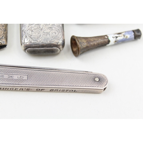 2215 - Five pieces of hallmarked sterling silver tobacciana, two vesta cases, one cigar cutter/knife and tw... 